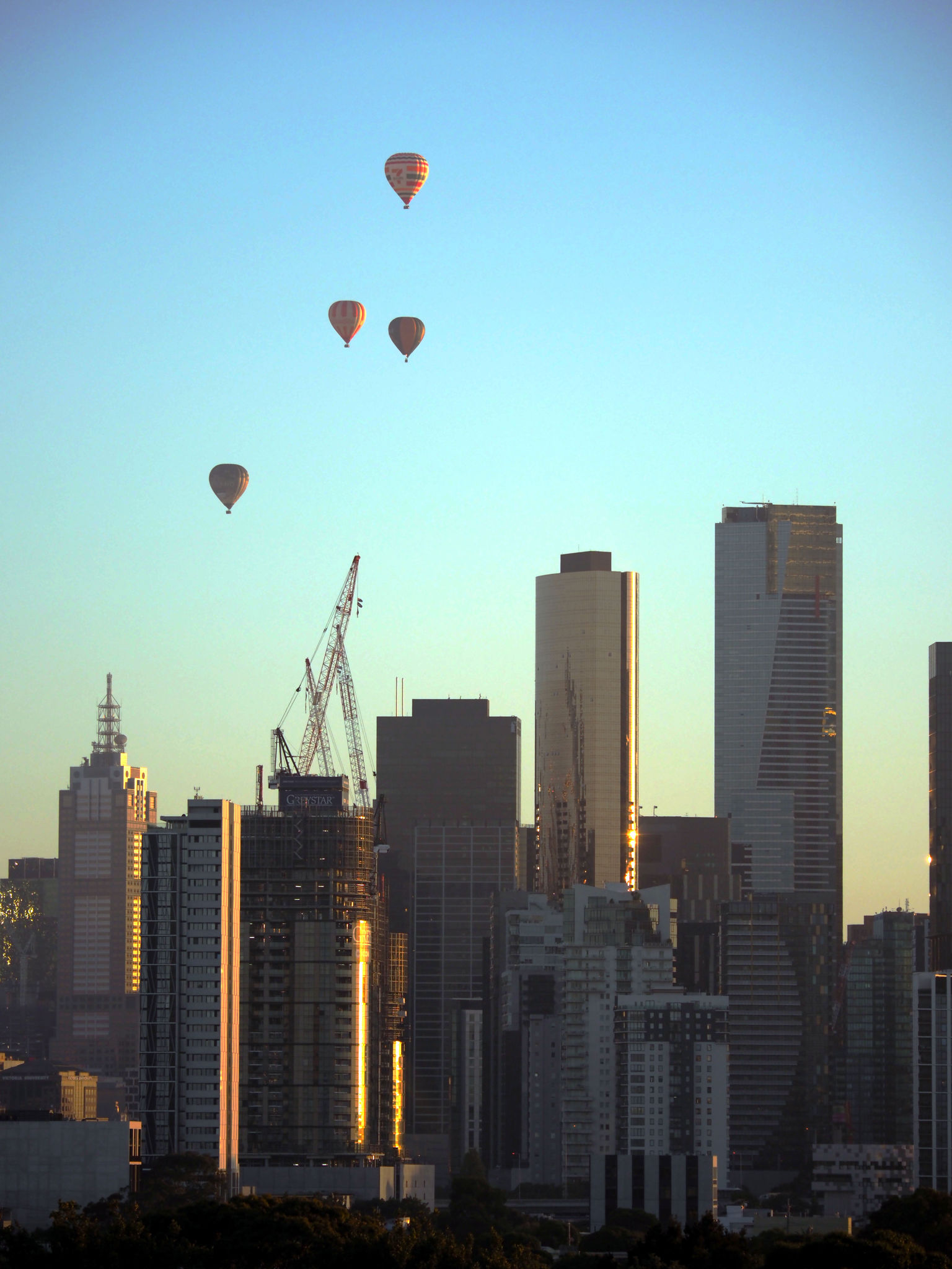  Melbourne, 2 Feb 2024  Sunrise hot air ballooning over the CBD.