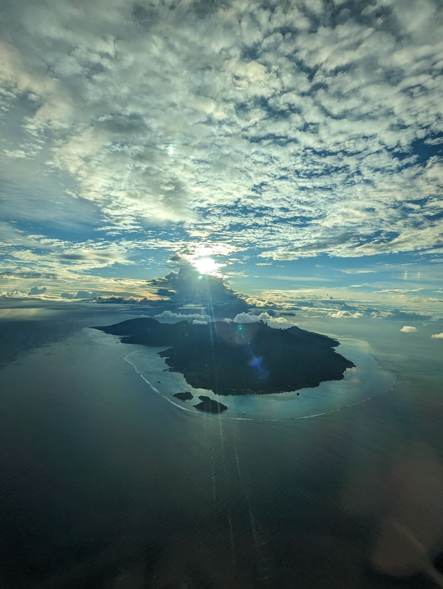  French Polynesia, 3 Jan 2024  Sunrise approach to Faa'a International Airport on Tahiti.